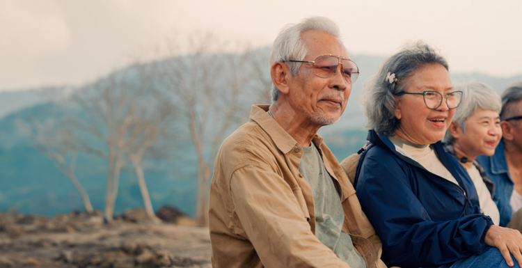 Actor portrayal of a group of elderly people in a mountainous setting