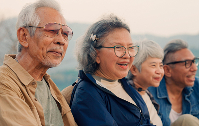 Actor portrayal of a group of elderly people in a mountainous setting